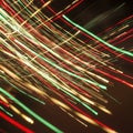 Dynamic light trails create an abstract pattern of red green and yellow lines on a dark background Royalty Free Stock Photo