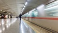 motion blur of a subway train arriving at an underground station with a passenger silhouette waiting Royalty Free Stock Photo