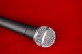 Dynamic microphone on red floor for music Royalty Free Stock Photo