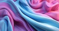 Dynamic motion silk fabric flowing forming blue and pink background.