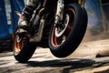 A motorbike tire skidding across a race track.