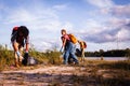 Active Stewards: Team Effort in Lakeside Conservation Royalty Free Stock Photo