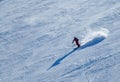 Dynamic photo of skier downhill in fresh snow on a sunny winter day at the Madonna di Campiglio Ski Resort.
