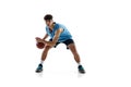 Dynamic portrait of basketball player practicing isolated on white studio background. Sport, motion, activity, movement