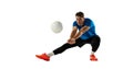 Dynamic portrait of male volleyball player training with ball isolated on white studio background. Sport, gym, team Royalty Free Stock Photo