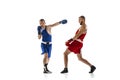 Dynamic portrait of two professional boxer in sports uniform boxing on white background. Concept of sport