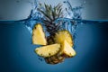A dynamic portrayal of water splash with sliced pineapple