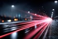 Dynamic red light trails on futuristic road at night, symbolizing fast data transmission and advanced technology Royalty Free Stock Photo