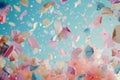 A dynamic scene captures a multitude of pink and blue confetti swirling and scattering through the air in vibrant celebration,