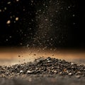Dynamic shot of soil particles in motion against dark background