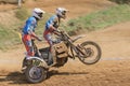 Dynamic shot of two racers standing on the sidecar