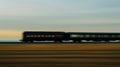 Dynamic side view of a fast moving train with blurred landscape creating a sense of speed