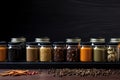 Dynamic Spice Ensemble: Up-close composition highlighting the dynamic arrangement of diverse spices in containers on a