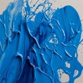 Dynamic splashes and swirls of vibrant blue paint on a white Royalty Free Stock Photo