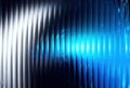 Dynamic Textured Surface Featuring Vertical Lines with a Luminescent Gradient from Bright White to Intense Electric Blue Royalty Free Stock Photo