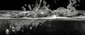 Dynamic Water Splash Captured in Black and White with Bubbles and Reflections Creating a Stunning Visual Effect Royalty Free Stock Photo