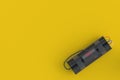 Dynamite bomb with digital timer in corner on yellow background Royalty Free Stock Photo