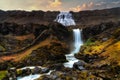 Dynjandi waterfall with tiered waterfalls in the foreground. Shot during early morning sunrise during autumn. Long Exposure