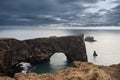 Dyrholaey Arch and Atlantic ocean, Dyrholaey, south Iceland Royalty Free Stock Photo