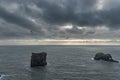 Dyrholaey Area in Iceland. Close to Black Sand Beach. Sunrise. Flying Bird and Rock in Background. Royalty Free Stock Photo