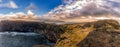 Dyrholaey Area in Iceland. Close to Black Sand Beach. Sunrise. Lighthouse in Background. Panorama. Royalty Free Stock Photo