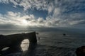 Dyrholaey Area in Iceland. Close to Black Sand Beach. Sunrise. Rocks in Water.