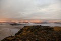 Amazing landscape with basalt rock formations Troll toes (Trolls fingers) on Black Beach. Ocean waves flow around stones. Midnight Royalty Free Stock Photo