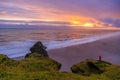 Amazing landscape with basalt rock formations Troll toes (Trolls fingers) on Black Beach. Ocean waves flow around stones. Midnight Royalty Free Stock Photo