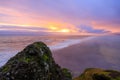 Amazing landscape with basalt rock formations Troll toes (Trolls fingers) on Black Beach. Ocean waves flow around stones. Midnight Royalty Free Stock Photo