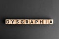 Dysgraphia - word from wooden blocks with letters