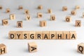 Dysgraphia - word from wooden blocks with letters