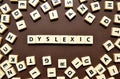 Dyslexic letters brown background