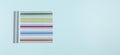 Dyslexia. Top view to colorful reading highlight bookmark overlay strips on light blue background. Reading rulers