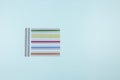 Dyslexia. Top view to colorful reading highlight bookmark overlay strips on light blue background. Reading rulers