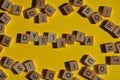 Dyslexia, word in 3d wood alphabet letters on yellow background