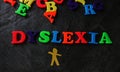 Dyslexic child play letters