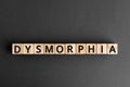 Dysmorphia - word from wooden blocks with letters