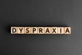 Dyspraxia - word from wooden blocks with letters Royalty Free Stock Photo