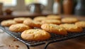 Golden-Brown Cookies Cooling on Wire Rack with Baking Tools in Warm Kitchen Scene Royalty Free Stock Photo