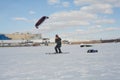 Dzerzhinsk, Nizhny Novgorod region, Russia, 03.21.2021 Speedriding skiing with a wing over your head. Spring blue sky gusty wind s