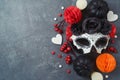 DÃÂ­a de los Muertos day of the dead holiday concept. Sugar skull mask and Mexican party decorations  on dark background. Top view Royalty Free Stock Photo