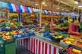 Colorful market stall with fresh local seasonal fruits and vegetables