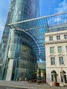 Futuristic glass tower, skywalk and roof, combination of modern contemporary with old hostoric architecture Royalty Free Stock Photo