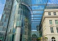 Futuristic glass tower, skywalk and roof, combination of modern contemporary with old hostoric architecture Royalty Free Stock Photo