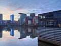 DÃÂ¼sseldorf, Germany - January 1, 2021: Beautiful New Years sunset in the media harbour. Colorful sky and reflections in the river