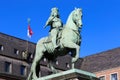 Closeup of isolated jan wellem equestrian statue in front of town hall against blue sky