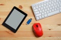 E-book reader with blank screen and keyboard and mouse and flash drives USB. on wooden floor, Used modern gadgets or electronic Royalty Free Stock Photo