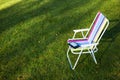 E-Book reader on the chair, green grass background