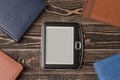 E-book reader close-up on wooden background Royalty Free Stock Photo