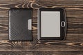 E-book reader close-up on wooden background Royalty Free Stock Photo